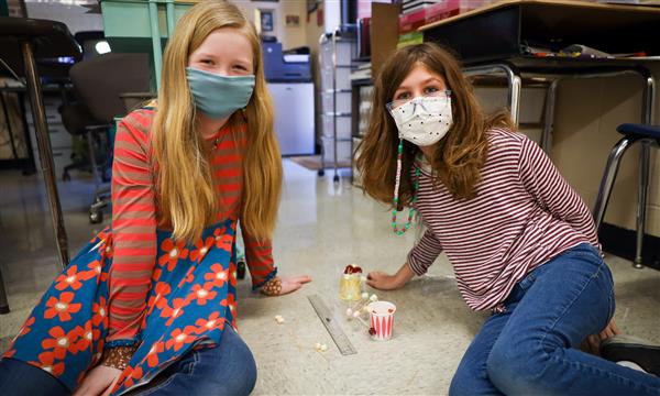 students work to build a bridge